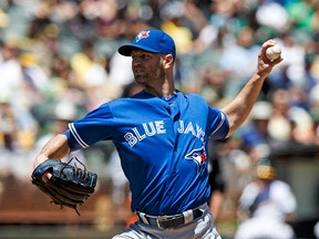 J.A. Happ of the Toronto Blue Jays pitches against the Oakland Athletics during the first inning at the Oakland Coliseum on July 17, 2016. (Jason O. Watson/Getty Images)