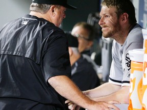 Chicago White Sox pitcher Chris Sale talks with pitching coach Don Cooper after Sale threw eight shutout innings against the Seattle Mariner on July 18, 2016, in Seattle. (AP Photo/Ted S. Warren)