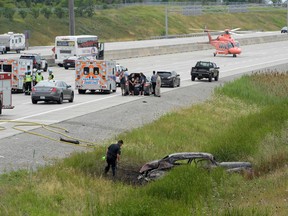 Emergency crews at the scene of a fatal crash on Hwy. 407 at Mississauga Rd. Sunday, July 24, 2016. (Andrew Collins photo)