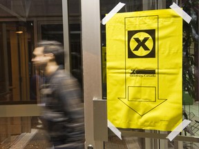 A voter comes from a polling center after casting his ballot October 14, 2008 in St. Laurent, Quebec, Canada. ROGERIO BARBOSA/AFP/Getty Images)