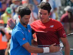 Novak Djokovic, of Serbia, greet Milos Raonic, of Canada, after their finals match at the BNP Paribas Open tennis tournament in Indian Wells, Calif., on March 20, 2016. (AP Photo/Mark J. Terrill)