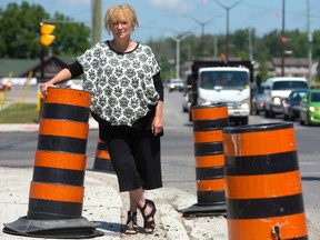 Donna Szpakowski, the president of the Hyde Park business association will be glad to see the end of construction pylons as after two years of construction during the widening of Hyde Park road the construction will come to an end next week in London. (MIKE HENSEN, The London Free Press)