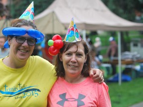 It's Your Birthday organizers Kathy Dahmer and Barb Cote take a break from hosting the celebration at Memorial Park on Sunday. (Keith Dempsey/For The Sudbury Star)