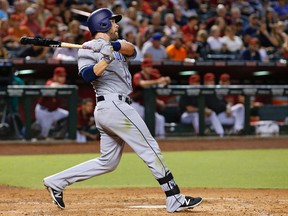 San Diego Padres' Ryan Schimpf watches the flight of his two-run home run against the Arizona Diamondbacks during the fourth inning of a baseball game July 6, 2016, in Phoenix. (ROSS D. FRANKLIN/AP)