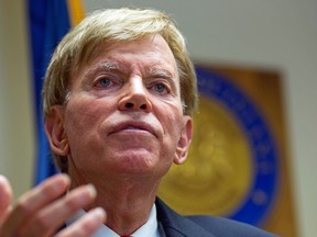 In this July 22, 2016, photo, former Ku Klux Klan leader David Duke talks to the media at the Louisiana Secretary of State's office in Baton Rouge, La. And far from hiding in chat rooms or under white sheets, they cheered the GOP presidential nominee inside the Republican National Convention over the last week. (AP Photo/Max Becherer)