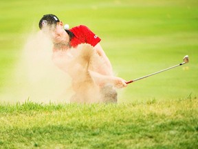Jared du Toit of Canada his out of the bunker on the second hole during the final round at the 2016 Canadian Open in Oakville, Ont., on Sunday, July 24, 2016. THE CANADIAN PRESS/Nathan Denette