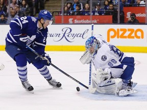 Tampa Bay Lighting goalie Andrei Vasilevskiy makes a save on Toronto Maple Leafs' Peter Holland during a game on March 15, 2016. (THE CANADIAN PRESS/Mark Blinch)
