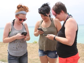 Terilyn Nutt (left), Courtney Begg, and Kathleen Nutt, were at the Goderich Main Beach on July 20 catching Pokemon. (Laura Broadley/Goderich Signal Star)