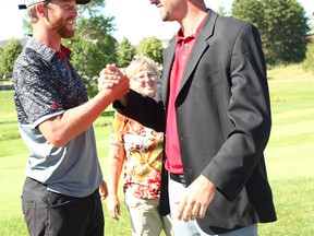 Last year’s Seaforth Country Club Classic champion, David Markle shakes hands with the new champion, Michael Gligic.(Shaun Gregory/Huron Expositor)