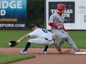 Hamilton Cardinals batter David Vanderby beats London Majors second baseman Chris McQueen to the base after he was spotted leaning from the base during their Intercounty Baseball League game at Labatt Memorial Park in London, Ont. on Friday May 20, 2016. (Free Press file photo)