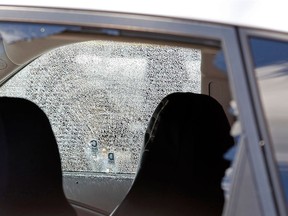 A car hit by gunfire sits outside of Club Blu where two people were killed and at least 15 wounded on July 25, 2016 in Fort Myers, Fla. (Photo by Mike Carlson/Getty Images)