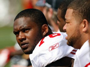 In this Sept. 25, 2011, file photo, San Francisco 49ers offensive tackle Anthony Davis sits on the bench during the first half of an NFL football game against the Cincinnati Bengals, in Cincinnati. (AP Photo/Ed Reinke, File)