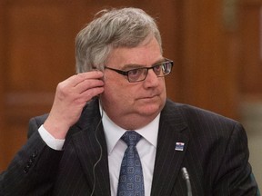 Parliamentary Budget Officer Jean-Denis Frechette waits to appear at the House of Commons Finance committee on Parliament Hill in Ottawa, Tuesday April 19, 2016. THE CANADIAN PRESS/Adrian Wyld