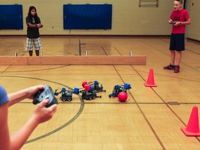 Students attending the three week Grade 6-8 summer camp at St. Thomas More Catholic School in Kingston got the chance to put their robotic skills, which they've spent the last two weeks learning, to the test in a friendly game of robotic soccer. (Julia McKay/The Whig-Standard)