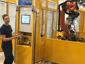 Sodecia, Portugese auto parts maker in London, unveiled its new research and development centre on Innovation Drive.  Jessy Underhill, a robot technician, works a machine on the shop floor of the new Global Tech and Automation Centre in London. (NORMAN DeBONO, The London Free Press)