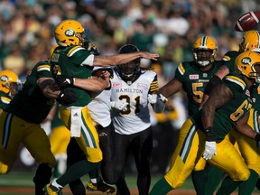 Eskimos quarterback Mike Reilly took some huge hits during the second half of Saturday's game against the Hamilton Tiger-Cats. (Greg Southam)