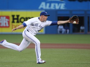 Aaron Sanchez of the Toronto Blue Jays tries to field the ball during MLB action against the San Diego Padres Monday, July 25, 2016 at Rogers Centre in Toronto. (Tom Szczerbowski/Getty Images)