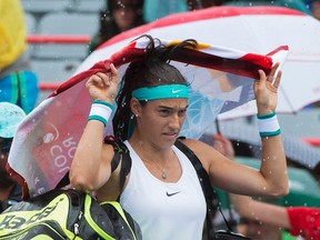 Caroline Garcia walks off court during a rain delay in her match against Barbora Strycova at the Rogers Cup in Montreal Monday, July 25, 2016. (THE CANADIAN PRESS/Graham Hughes)