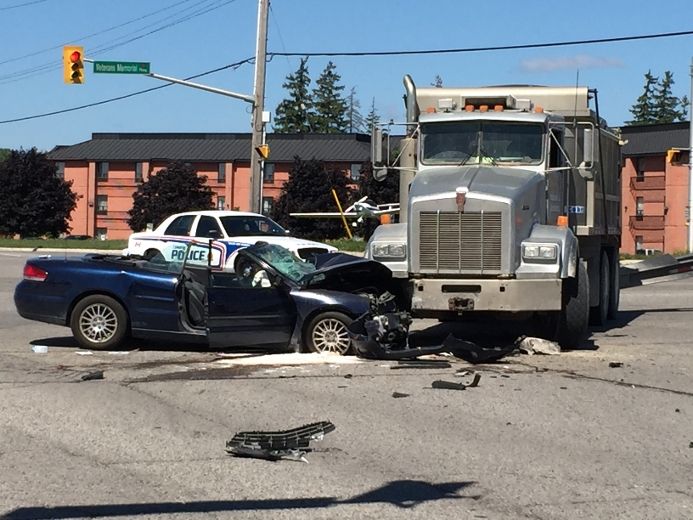 Serious crash between car and dump truck at Dundas Street and Veterans