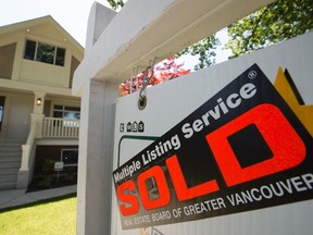 A sold sign is pictured outside a home in Vancouver in this June, 28, 2016 file photo. (THE CANADIAN PRESS/Jonathan Hayward)
