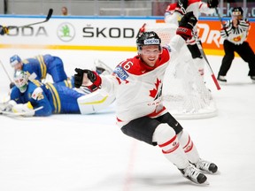 Canada’s Max Domi, centre, celebrates his goal against Sweden’s Jacob Markstrom during the world championship in St.Petersburg, Russia, Thursday, May 19, 2016. (AP Photo/Dmitri Lovetsky)