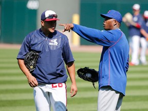 Chicago Cubs reliever Aroldis Chapman, right, chats with Chicago White Sox’s Avisail Garcia before a game Tuesday, July 26, 2016, in Chicago. (AP Photo/Charles Rex Arbogast)