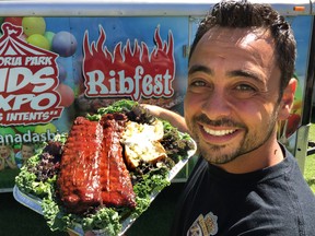 Ribber Gus Sakellis of Ribs Royale shows off a platter of his famous ribs and smoked potatoes that he will be serving up during Ribfest. (DEREK RUTTAN, The London Free Press)