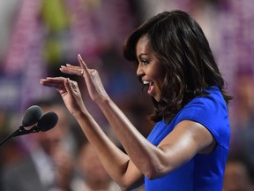 U.S. First Lady Michelle Obama addresses delegates on Day 1 of the Democratic National Convention at the Wells Fargo Center in Philadelphia, Pennsylvania, July 25, 2016. (Robyn BECKROBYN BECK/AFP/Getty Images)