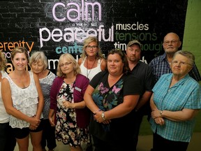 Emily Mountney-Lessard/The Intelligencer
Participants of a suicide bereavement group, hosted by the Canadian Mental Health Association, pose for a photo prior to their meeting on Tuesday in Belleville.