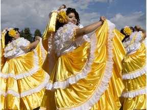 Members of the Raices Salvadorenas dance group perform during the preview of the Heritage Festival in Edmonton's Hawrelak Park, on Tuesday July 26, 2016.