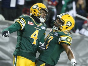 Adarius Bowman, left, and Derel Walker celebrate a Bowman touchdown during last season's Grey Cup game. Both receivers have picked up where they left off last season, racking up multiple 100-plus yard games this year. (File)