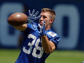 Indianapolis Colts running back Tyler Varga makes a catch as the team opens NFL football training camp in Anderson, Ind., Sunday, Aug. 2, 2015. (AP Photo/Michael Conroy)