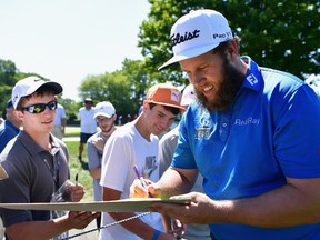 Andrew Johnston of England signs autographs during a practice round prior to the 2016 PGA Championship at Baltusrol Golf Club on July 26, 2016 in Springfield, N.J. (Stuart Franklin/Getty Images)