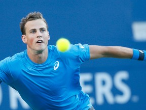 Vasek Pospisil returns a shot to Jeremy Chardy during the Rogers Cup at the Aviva Centre at York University in Toronto Tuesday July 26, 2016. (Stan Behal/Toronto Sun/Postmedia Network)