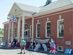 Visitors arrive at the Rossignol Cultural Centre in Liverpool, N.S. on Tuesday, July 19, 2016. The building houses the Outhouse Museum, as well as a wildlife exhibit, an art gallery, a hunting and fishing museum featuring a replica of a trapper’s cabin, and a photography museum. Most of the objects have been gathered by Sherman Hines over the years but some have been donated by benefactors. THE CANADIAN PRESS/Andrew Vaughan