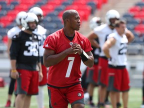 Quarterback Henry Burris of the Redblacks practices without a ball with his taped up finger during practice at TD Place in Ottawa on July 20, 2016. (Jean Levac/Postmedia)