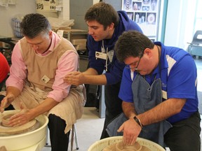 In this file photo, Nick Spanton, centre, helps Point Edward Coun. Brad Drury, left, and Myles Vanni, executive director of the Inn of the Good Shepherd, at the Celebrity Bowl-a-thon at held in 2014 at Lambton College. Drury was re-appointed to village council Tuesday, to fill a vacancy created when former Mayor Larry MacKenzie stepped down in June. (File photo/THE OBSERVER)