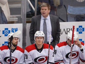 Carolina Hurricanes head coach Bill Peters stands behind his bench during an NHL hockey game against the Pittsburgh Penguins, in Pittsburgh. (AP Photo/Gene J. Puskar, File)