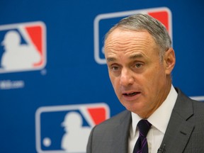MLB Commissioner Rob Manfred says more rule changes are needed to improve the pace of play, and one proposal under consideration is a limitation on relief pitching changes in an inning or a game. (Mary Altaffer/AP Photo/Files)