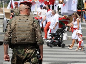 A French soldier patrols near a street stall in Bayonne, southwestern France on July 27, 2016 during the typically Basque Bayonne festival (Fetes de Bayonne).
The 80th Bayonne festival (Fetes de Bayonne), one of the largest popular event in the world, starts on July 27, 2016 with enhanced security measures, two weeks after the Nice attack in Nice. (AFP PHOTO / GAIZKA IROZGAIZKA IROZ/AFP/Getty Images)