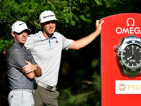 Rory McIlroy (left) and Dustin Johnson wait on the 10th tee during a practice round prior to the 2016 PGA Championship at Baltusrol Golf Club on July 27, 2016 in Springfield, N.J. (Stuart Franklin/Getty Images)