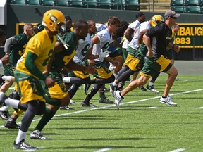 Eskimos head coach Jason Maas runs with the team during Monday's practice at Commonwealth Stadium. (Ed Kaiser)