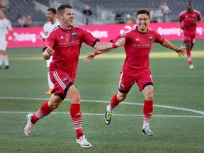 Carl Haworth (left) is joined by Bryan Olivera to celebrate his goal in the first half as the Ottawa Fury take on the Carolina Railhawks in NASL action at TD Place. (Wayne Cuddington/Postmedia)