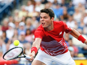 Milos Raonic reaches for a return during his Rogers Cup match against Yen-Hsun Lu at the Aviva Centre in Toronto Wednesday, July 27, 2016. (Stan Behal/Toronto Sun/Postmedia Network)
