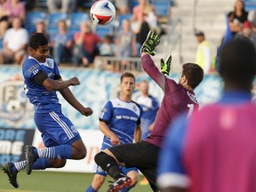 Shamit Shome heads the ball during Wednesday's match against the New York Cosmos at Clarke Stadium. (Ian Kucerak)