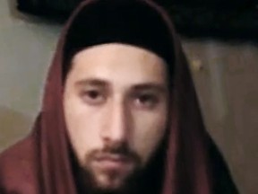 An image grab taken from a video released on July 27, 2016 by Amaq News Agency, an online service affiliated with the Islamic State (IS) group, purportedly shows French jihadist Abdel Malik Petitjean, 19, identifying himself as "Ibn Omar," one of the two men who stormed into a church in the northern French town of Saint-Etienne-du-Rouvray during morning mass and cut the throat of a priest at the altar.  (AFP/Getty Images)