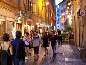 An evening stroll through city streets is an enjoyable tradition in Rome. (photo: Dominic Arizona Bonuccelli)