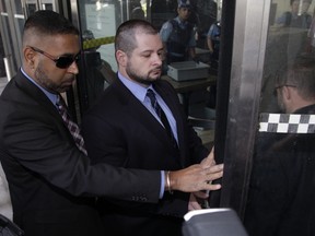 Const. James Forcillo enters the courthouse at 361 University Ave. for his sentencing on an attempted murder conviction in the shooting death of Sammy Yatim on a TTC streetcar in July 2013. (Ernest Doroszuk/Toronto Sun)