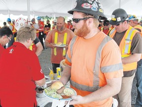 While enjoying lunch at their Union Gas worksite in Dawn-Euphemia Township Wednesday, Aecon workers and their company pledged almost $4,000 towards Shriners Hospitals for Children. Aecon has approximately 250 employees at the site, working on a $250-million expansion that will become operational in September 2017. (Carl Hnatyshyn/Postmedia Network)