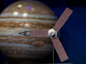 This NASA photo obtained July 4, 2016 shows a model of the Juno spacecraft at a news briefing, held before Juno enters orbit around Jupiter, on June 30, 2016 at the Jet Propulsion Laboratory (JPL) in Pasadena, Calif. (AFP PHOTO /NASA/Aubrey Gemignani/Getty Images)
